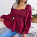 Dames gesmockte blouse met ruches