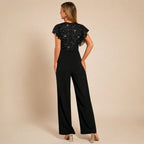 Dames jumpsuit met pailletten en wijde pijpen