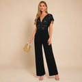 Dames jumpsuit met pailletten en wijde pijpen